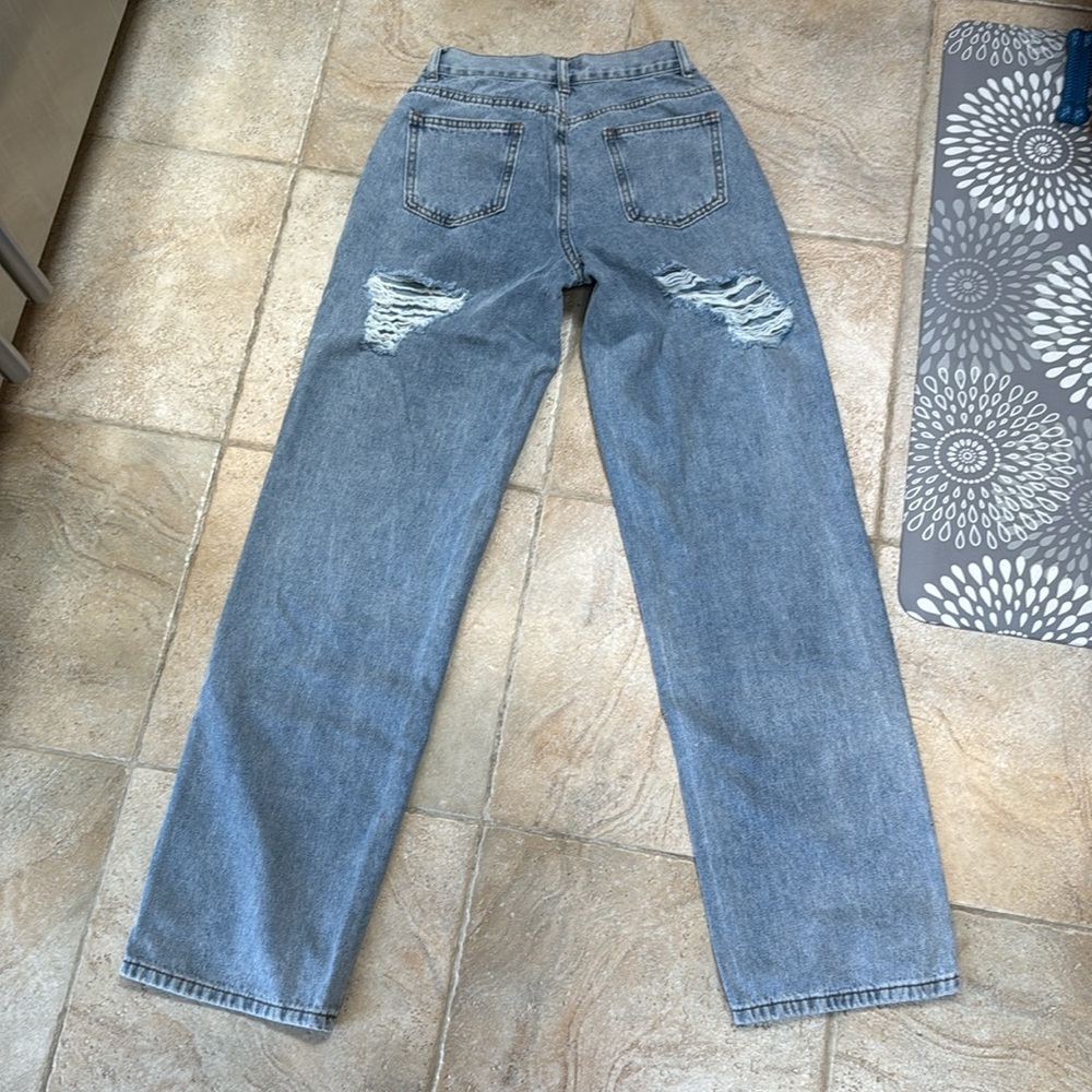 Ripped butt white fox jeans